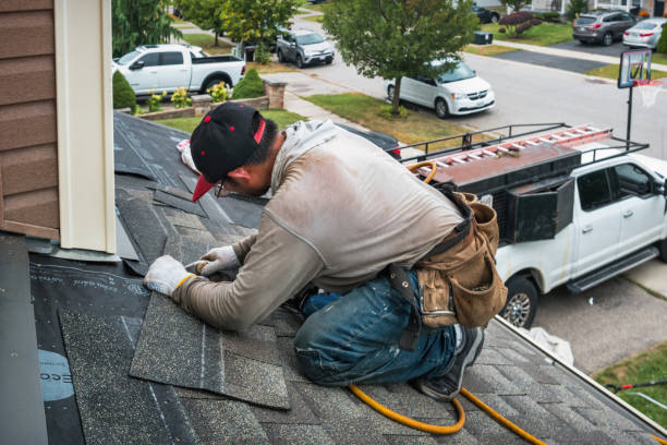 Professional Roofing technician working in East Moriches, NY